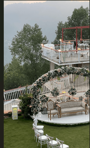 Daytime nikah ceremony setup with guest chairs and floral arch